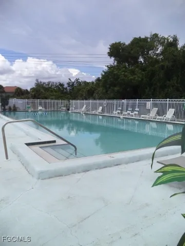 a view of a swimming pool with a lake view