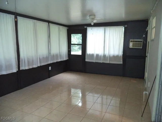 a kitchen with a sink a refrigerator and cabinets