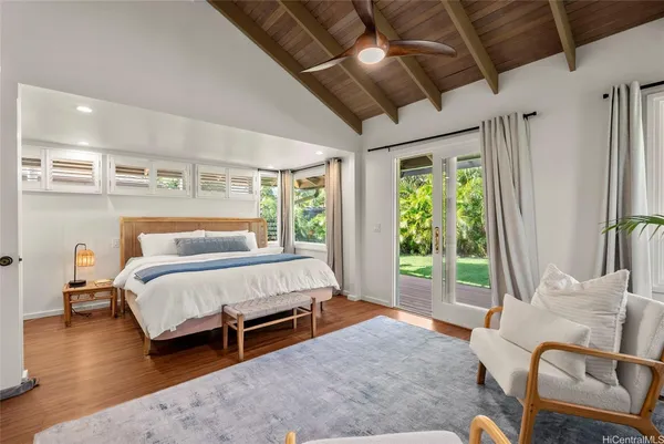 a bed room with a bed and a chair