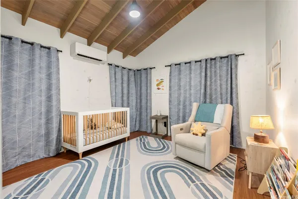 a bedroom with furniture and a window