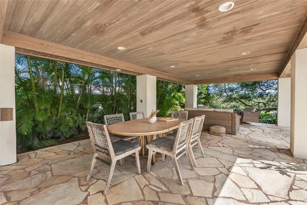 a view of a patio with a backyard