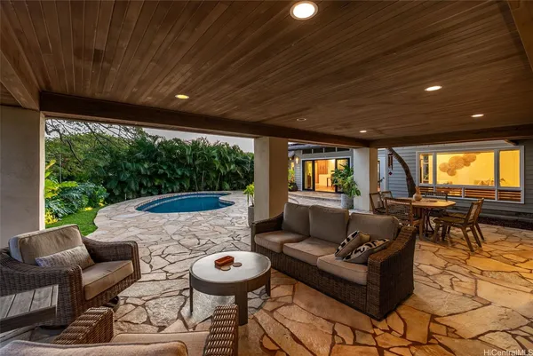 a outdoor space with patio the couches and a dining table with garden view