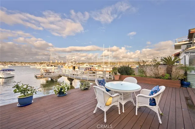 a view of a dining room with furniture wooden floor and chandelier
