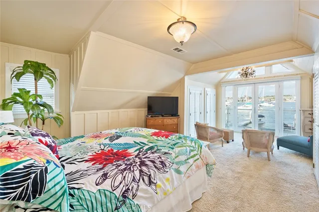 a bathroom with a granite countertop sink and a large mirror