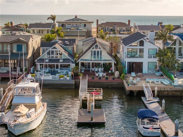 a aerial view of a house with outdoor seating