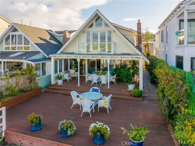 a front view of a house with a garden and patio