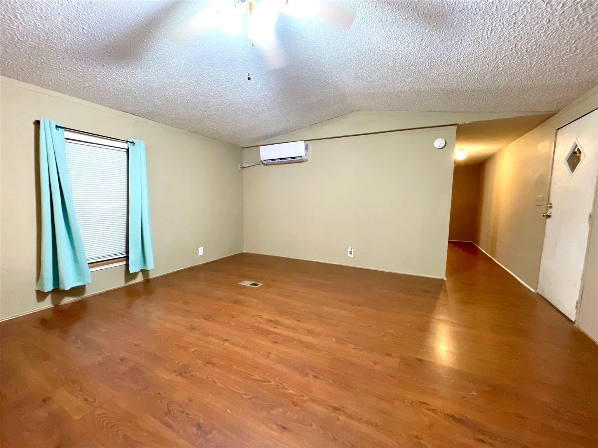 4730 Bayou Lane Rosharon, TX 77583 - Photo 6 of 13 an empty room with wooden floor and entrance