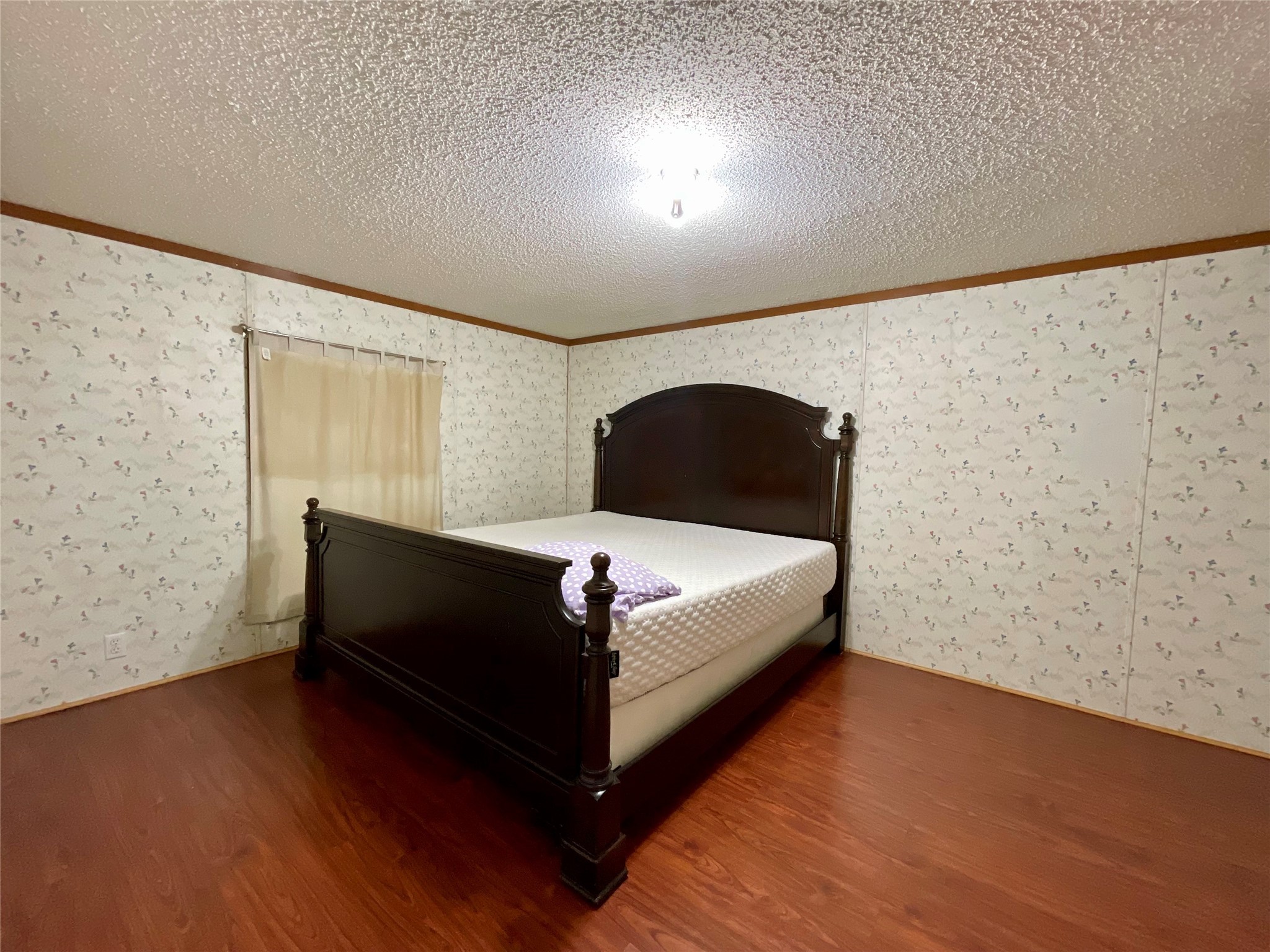4730 Bayou Lane Rosharon, TX 77583 - Photo 7 of 13 a bedroom with a bed and a night stand