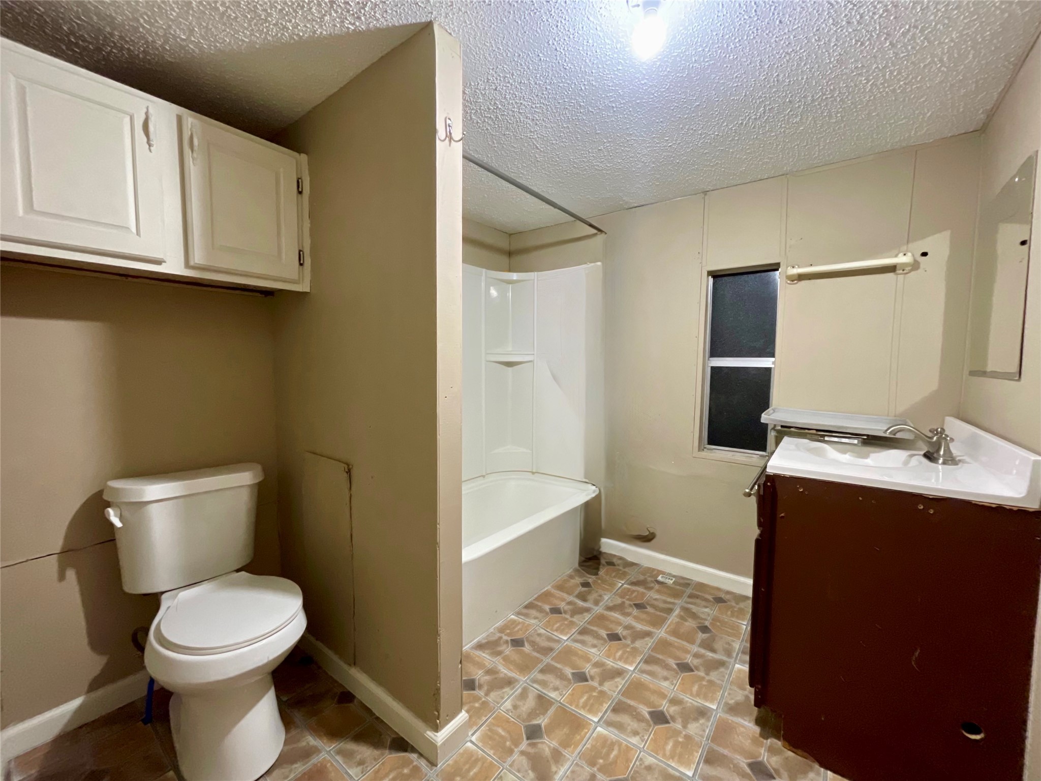 4730 Bayou Lane Rosharon, TX 77583 - Photo 8 of 13 a bathroom with a toilet sink and mirror