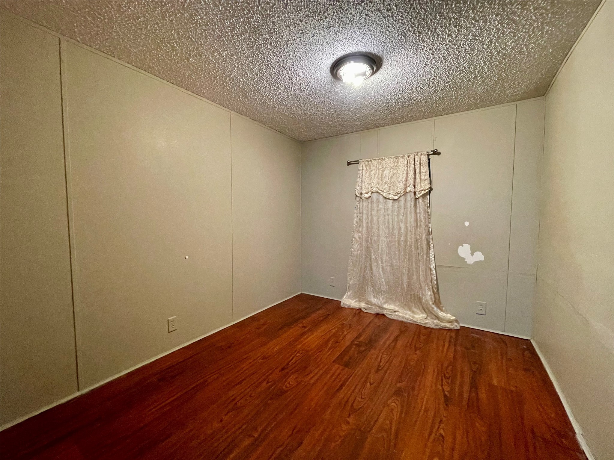 4730 Bayou Lane Rosharon, TX 77583 - Photo 10 of 13 a view of an empty room with wooden floor