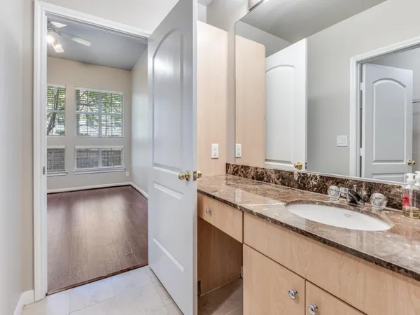 a bathroom with a double vanity sink and a mirror