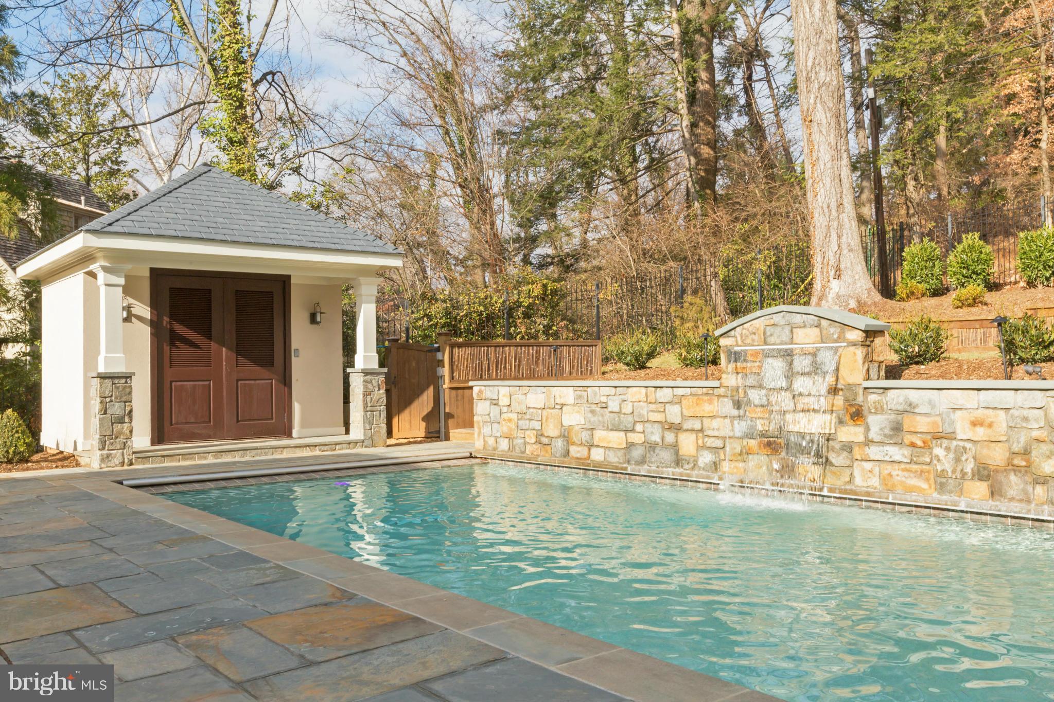 4871 Glenbrook Road Northwest Washington, DC 20016 - Photo 15 of 21 a view of a swimming pool with a patio
