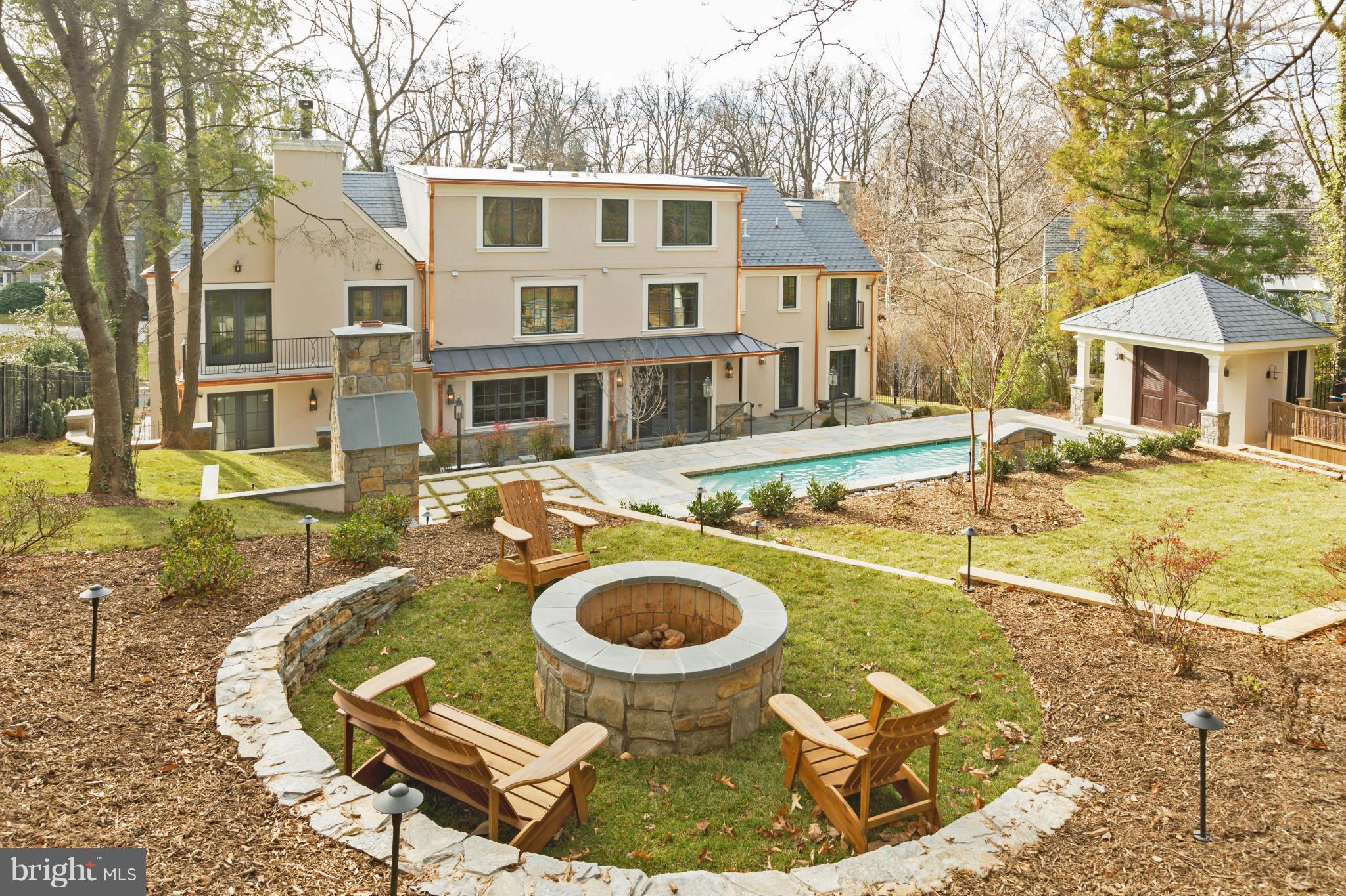 4871 Glenbrook Road Northwest Washington, DC 20016 - Photo 16 of 21 a view of a white house with swimming pool