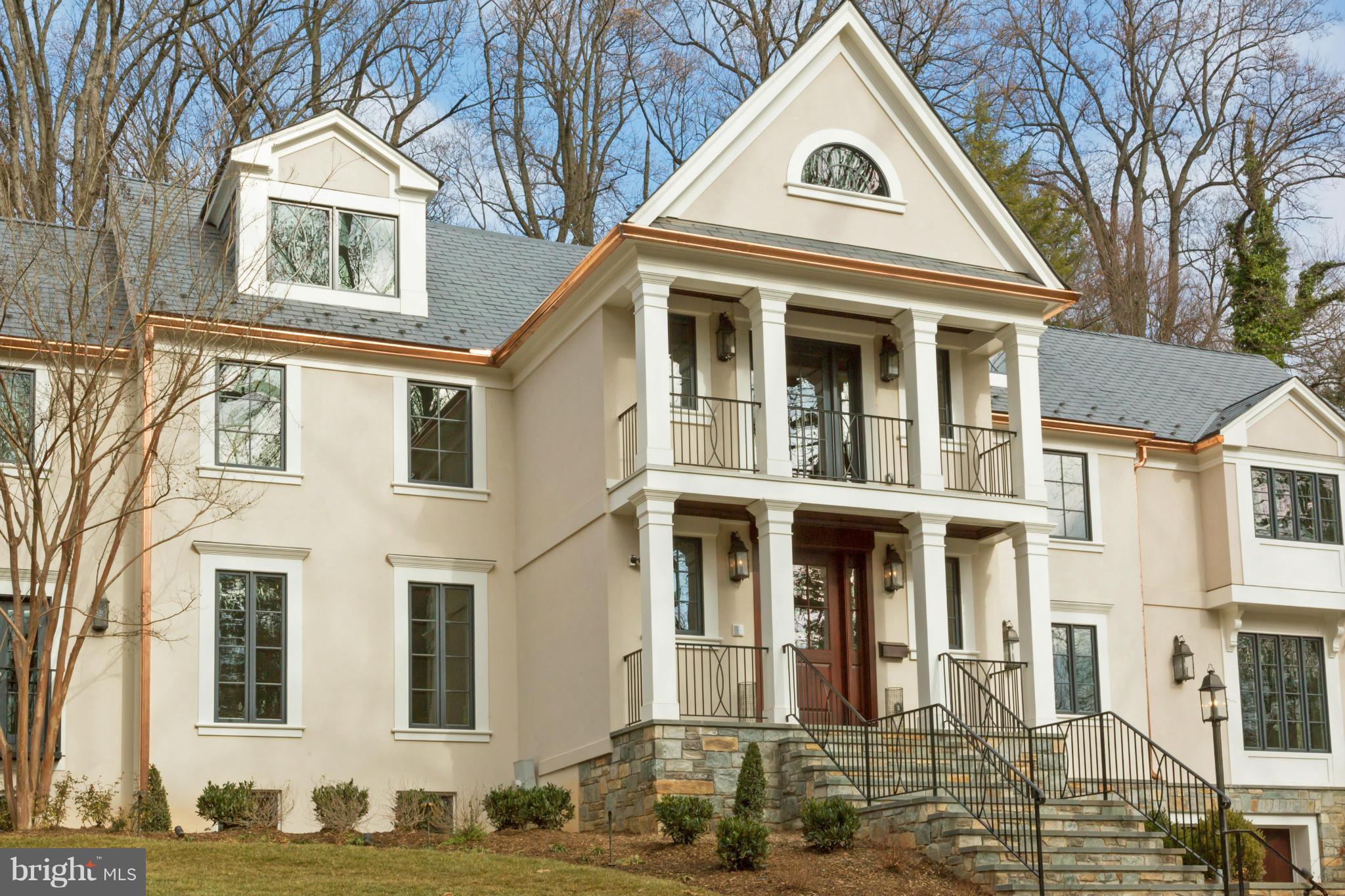 4871 Glenbrook Road Northwest Washington, DC 20016 - Photo 17 of 21 a view of a white house with large windows