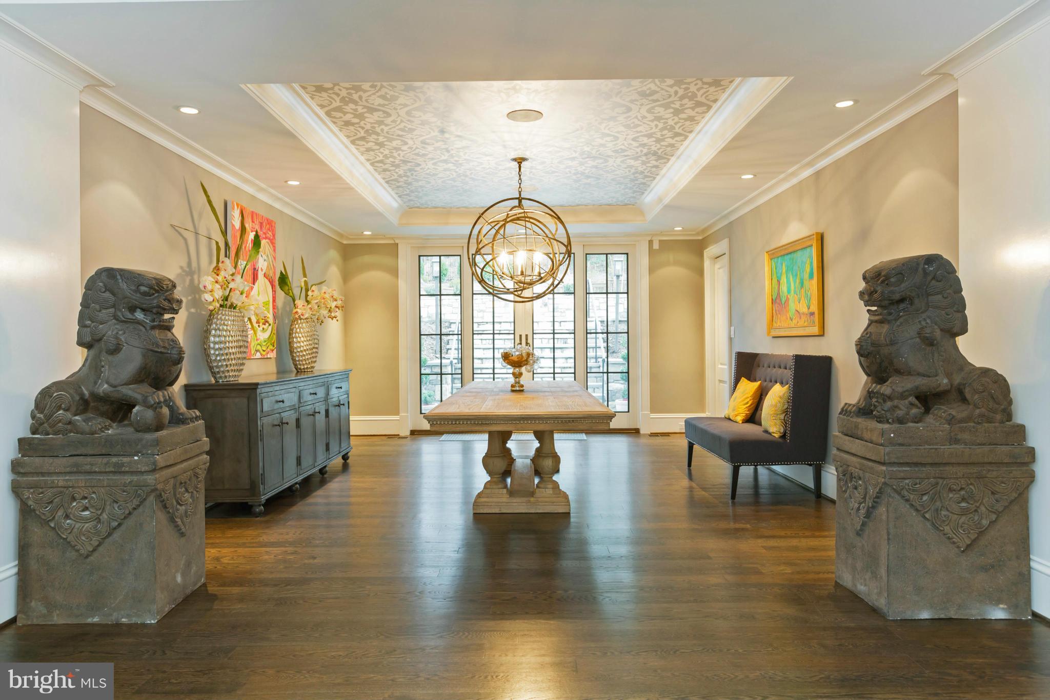4871 Glenbrook Road Northwest Washington, DC 20016 - Photo 3 of 21 a living room with furniture a table and a chandelier