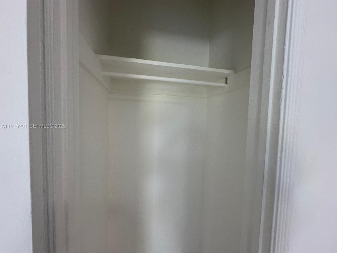 1293 Northeast 109th Street, Unit 3 Miami, FL 33161 - Photo 7 of 10 a close up view of racks on the wall