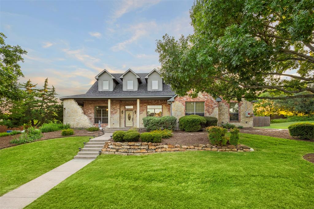105 Country Ridge Court Red Oak, TX 75154 - Photo 2 of 40 a front view of a house with a yard