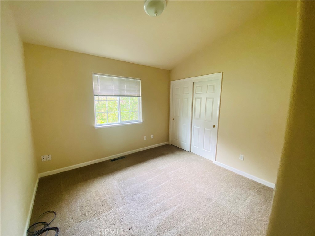 16506 Ridgecrest Court Hidden Valley Lake, CA 95467 - Photo 16 of 25 an empty room with a window