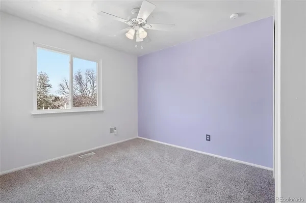 a kitchen with stainless steel appliances granite countertop a refrigerator a stove and a sink