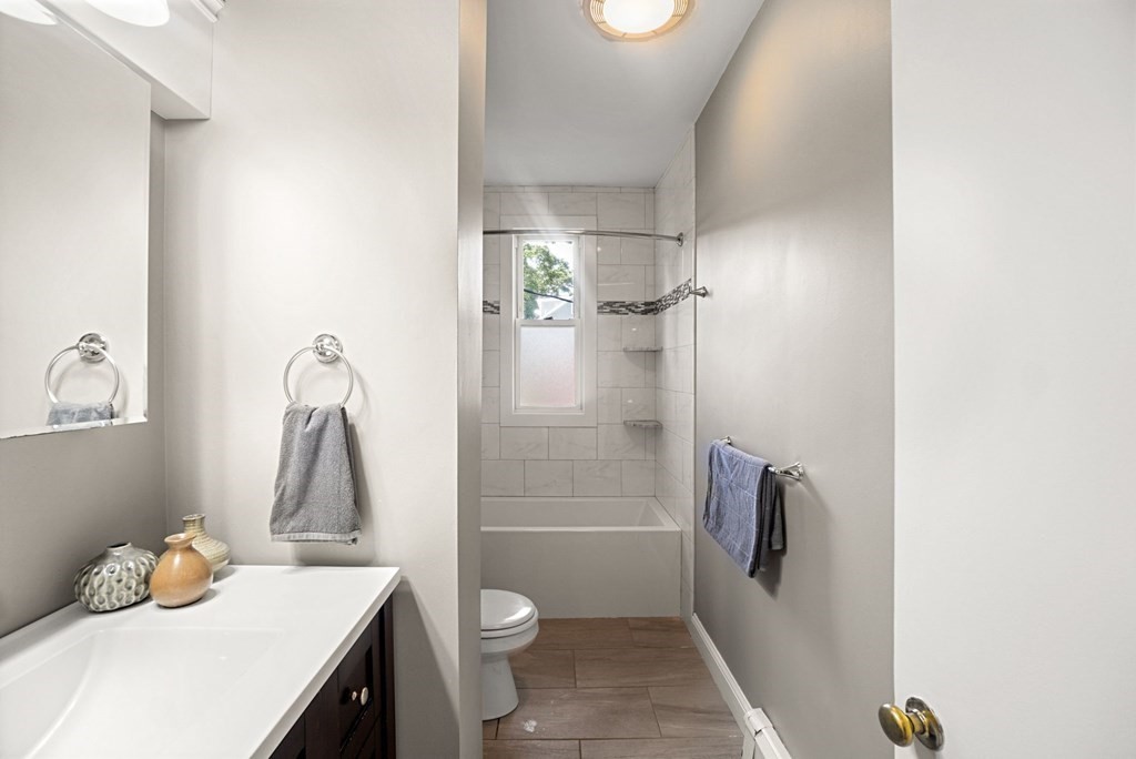90 Robbins Road, Unit 2 Arlington, MA 02476 - Photo 21 of 32 a bathroom with a sink toilet and shower