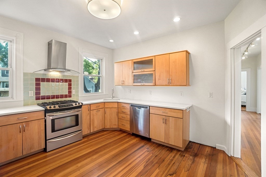 90 Robbins Road, Unit 2 Arlington, MA 02476 - Photo 6 of 32 a kitchen with granite countertop a stove and a sink