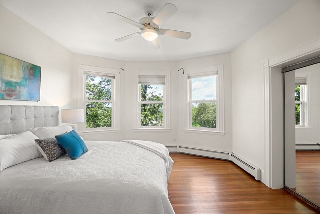 90 Robbins Road, Unit 2 Arlington, MA 02476 - Photo 8 of 32 a bedroom with a large bed and a window