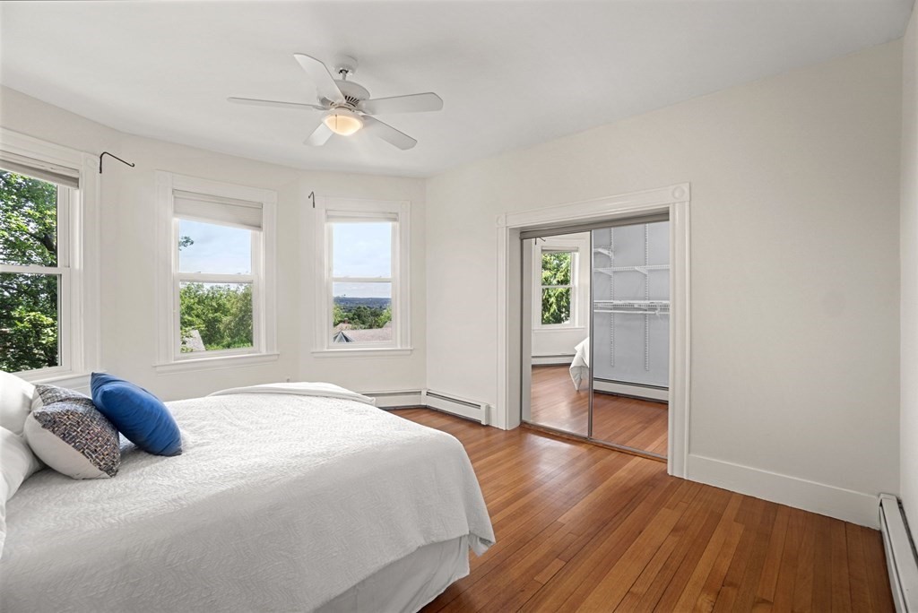 90 Robbins Road, Unit 2 Arlington, MA 02476 - Photo 10 of 32 a bedroom with a large bed and a window