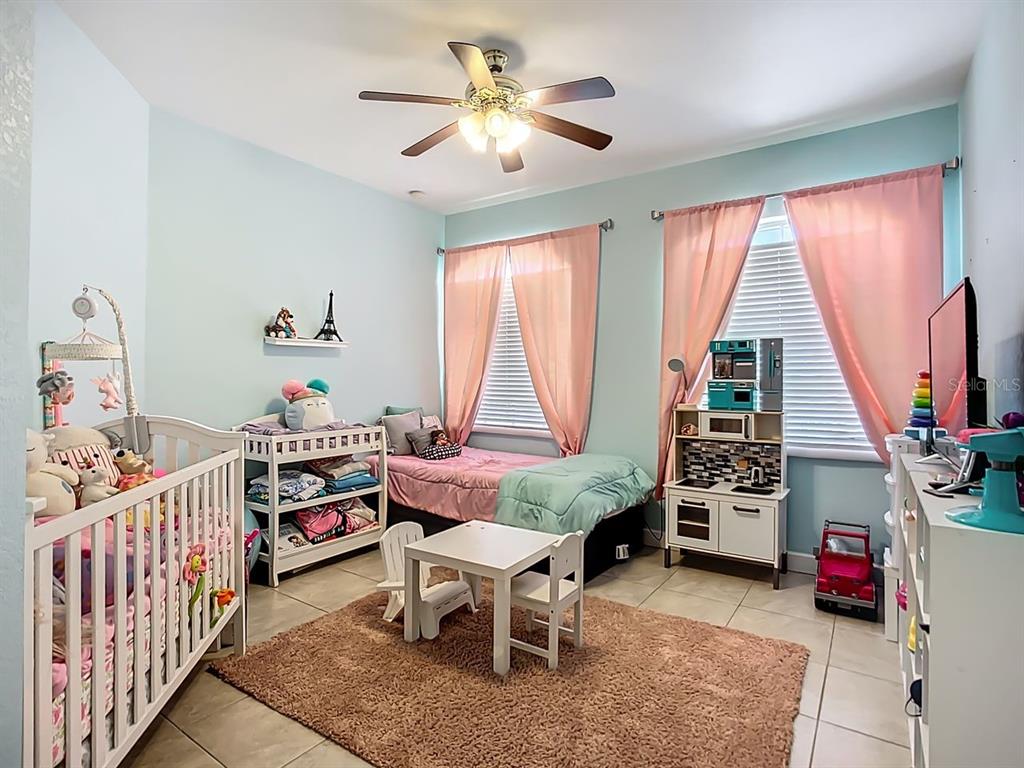 394 Sunset Road Rotonda West, FL 33947 - Photo 27 of 41 a room with furniture and a large window