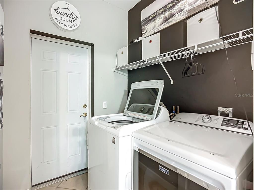 394 Sunset Road Rotonda West, FL 33947 - Photo 38 of 41 a utility room with dryer and washer