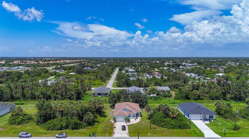 394 Sunset Road Rotonda West, FL 33947 - Photo 4 of 41 an aerial view of a city