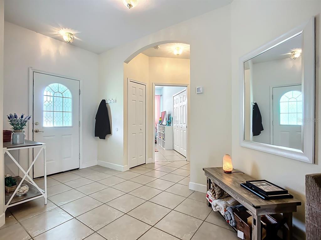 394 Sunset Road Rotonda West, FL 33947 - Photo 8 of 41 a view of kitchen with furniture and window