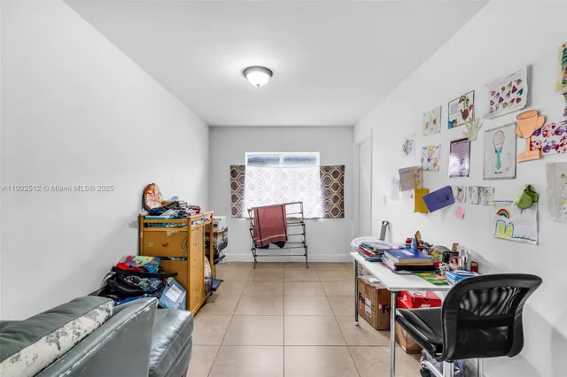 a bedroom with furniture and a window