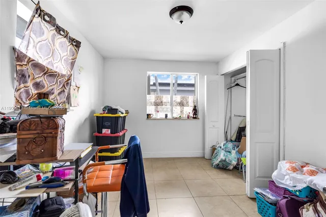 a bedroom with a large bed and a couch