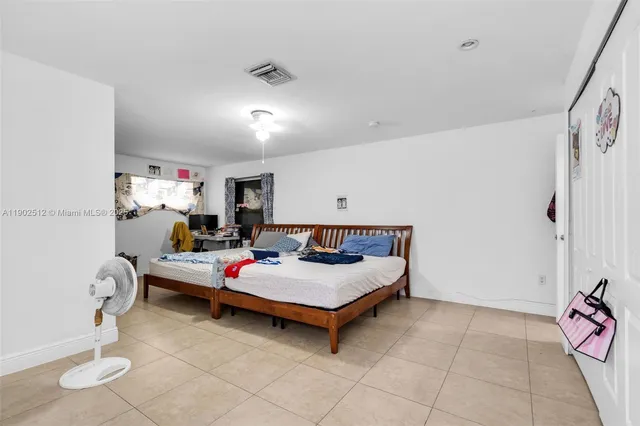 a bathroom with a toilet a sink and shower