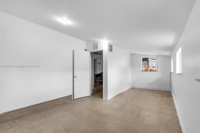 an empty room with a natural light