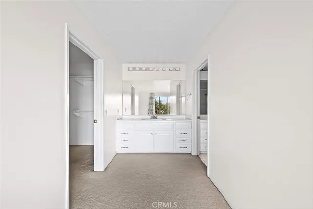 a room with a stove a sink and a refrigerator