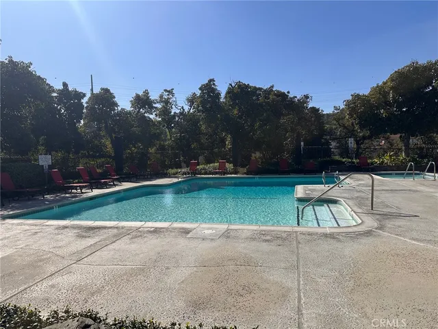 a view of outdoor space with playground and green space