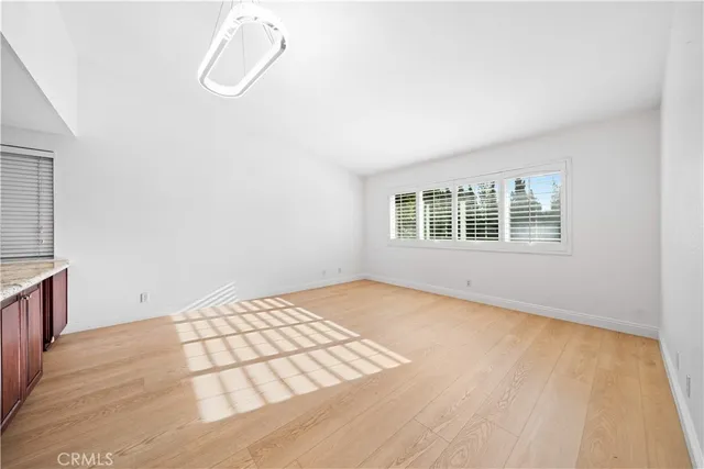 a view of an empty room with windows