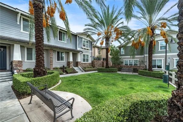 a view of a kitchen with a sink and dishwasher with a dining table
