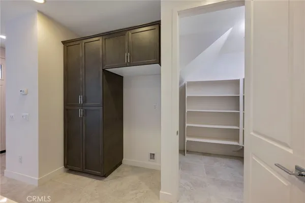 a kitchen with a sink stainless steel appliances and cabinets