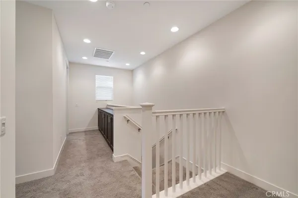 a bathroom with a sink a toilet a large mirror and shower