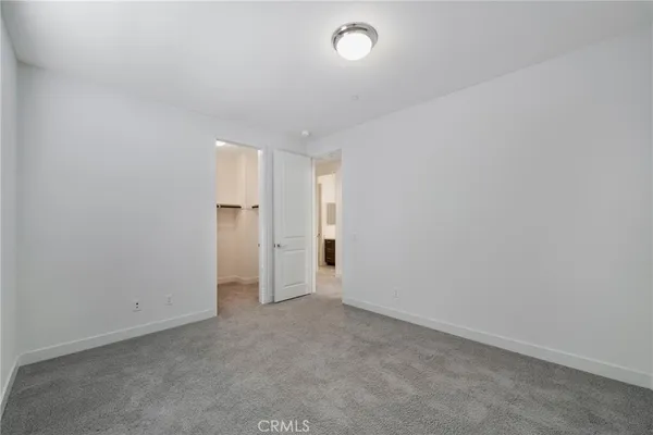 a view of an empty room and a window