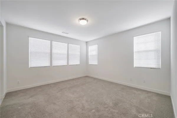 a spacious bathroom with a tub shower and a sink