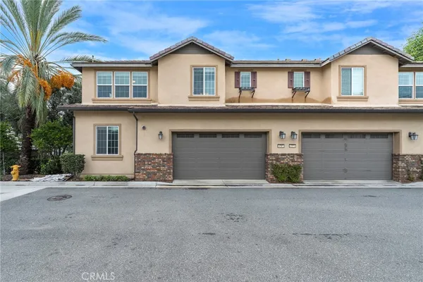 a front view of a house with a garage