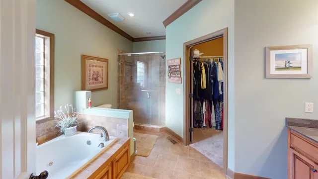a bathroom with a tub sink and a mirror