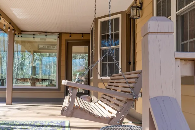 a view of a room with wooden floor and windows