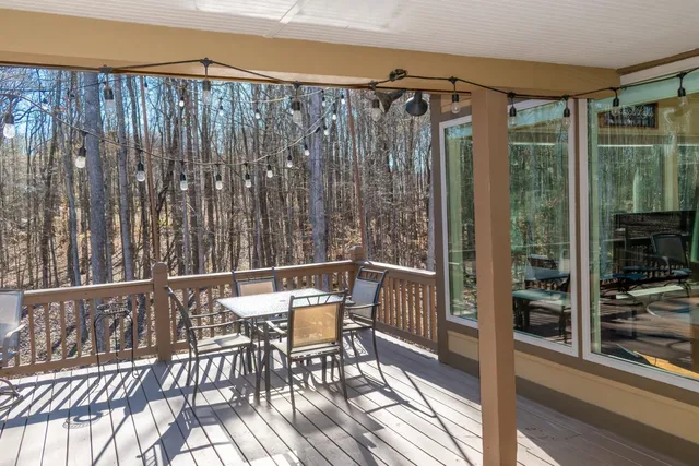 a view of a balcony with dining area
