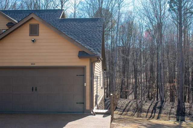 a view of a house with a backyard