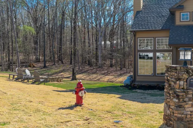 a small pool with a bench in front of it