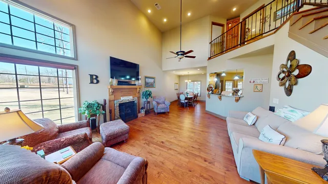 a living room with fireplace furniture and a flat screen tv
